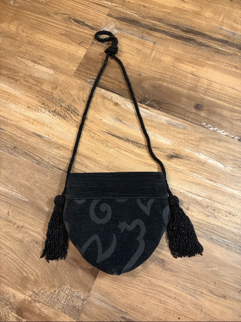 Vintage black Jacquard evening purse with beaded tassels and shoulder strap.